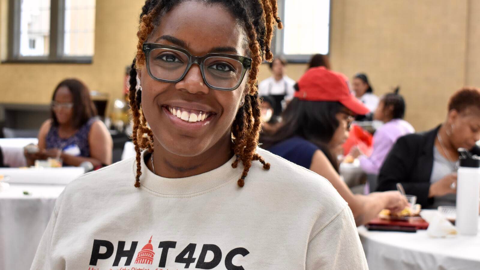 student wearing PHIT4DC sweatshirt
