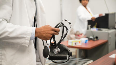 pharmacist holding a stethoscope
