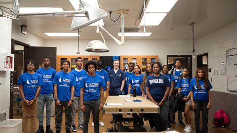 students standing with instructor