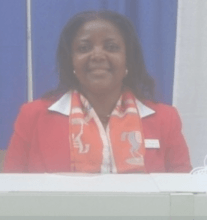 woman in red jacket smiling 